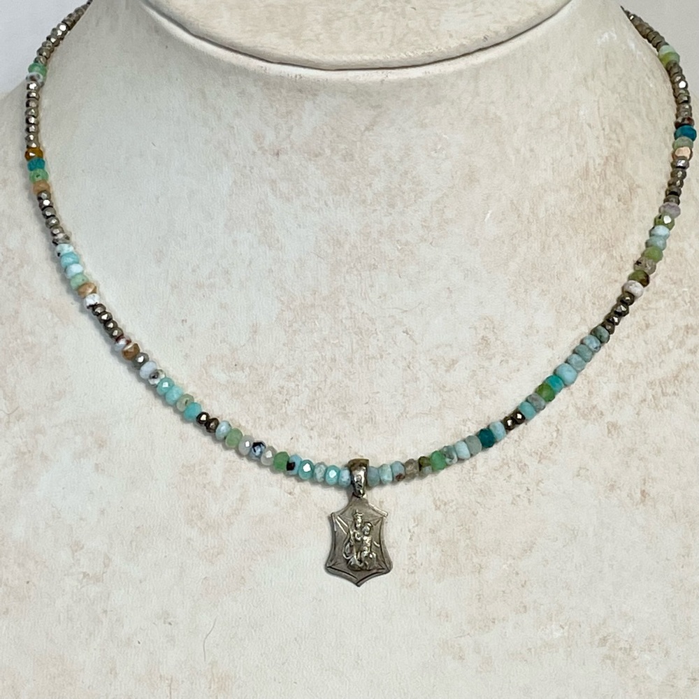 Blue tone gemstones with antique pendant